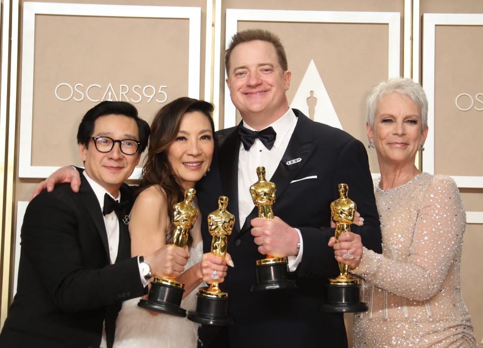 "The Whale" best actor winner Brendan Fraser (second from right) poses in the Oscar trophy room with "Everything Everywhere All at Once" honorees Ke Huy Quan (from left), Michelle Yeoh and Jamie Lee Curtis.