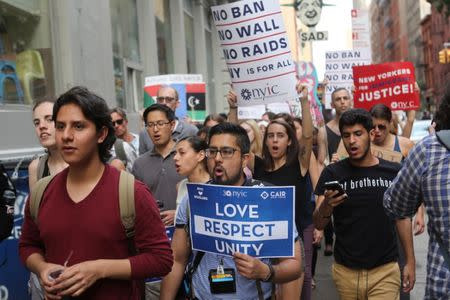 Protesters chant slogans against U.S. President Donald Trump's limited travel ban, approved by the U.S. Supreme Court, in New York City, U.S., June 29, 2017. REUTERS/Joe Penney