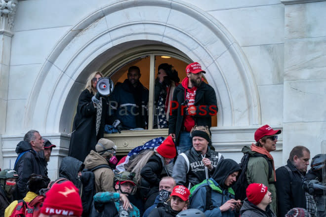 Gina Bisignano, video shows, was amongst the first group of rioters to enter the tunnel on the west side of the Capitol on Jan. 6, 2021. (Department of Justice)