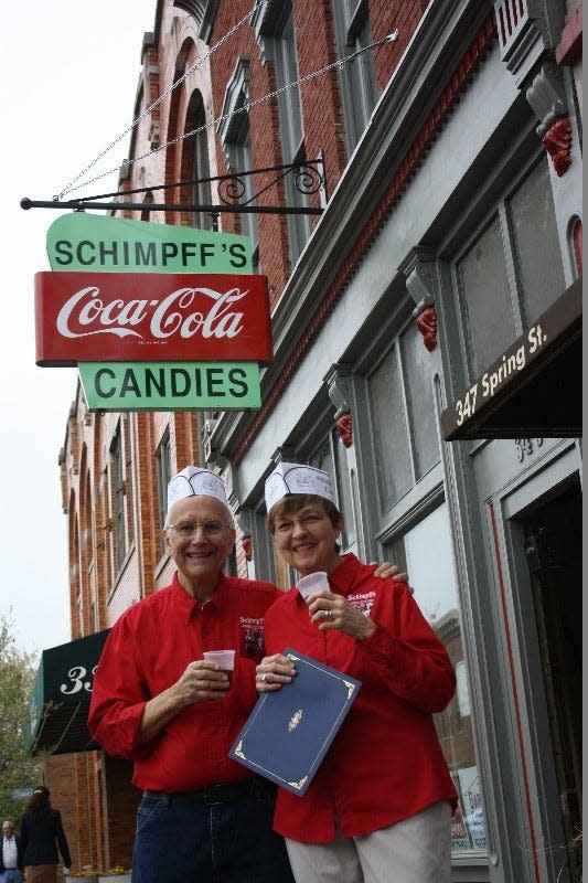 Warren and Jill Schimpff unveiled their newly refurbished sign at Schimpff's Confectionery  in April.