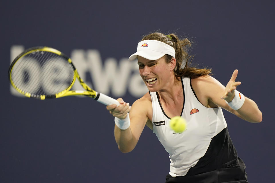 FILE - In this March 27, 2021, file photo, Johanna Konta, of Britain, returns a shot from Petra Kvitova, of the Czech Republic, during the Miami Open tennis tournament in Miami Gardens, Fla. Three-time Grand Slam semifinalist Konta, the only British woman seeded in singles at Wimbledon, was dropped from the tournament Sunday, June 27, 2021, because a member of her team tested positive for COVID-19. (AP Photo/Wilfredo Lee, File)