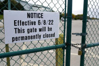 A sign is affixed to a gate at the shuttered Arlington International Racecourse in Arlington Heights, Ill., Friday, Oct. 14, 2022. The Bears want to turn the Arlington Heights site, once a jewel of thoroughbred racing, into a different kind of gem, anchored by an enclosed stadium and bursting with year-round activity — assuming a deal with Churchill Downs Inc. to buy the land goes through. (AP Photo/Nam Y. Huh)