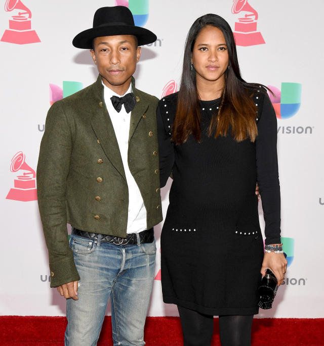 Pharrell Williams and Helen Lasichanh arriving to the Chanel show