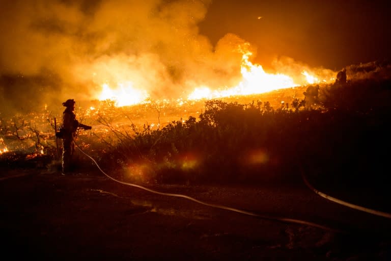Firefighters battle the "Thomas Fire" in Ventura County