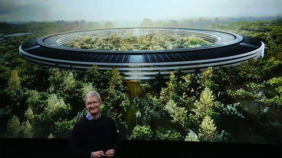 Apple CEO Tim Cook shows a rendering of the new Apple campus in March 2016.