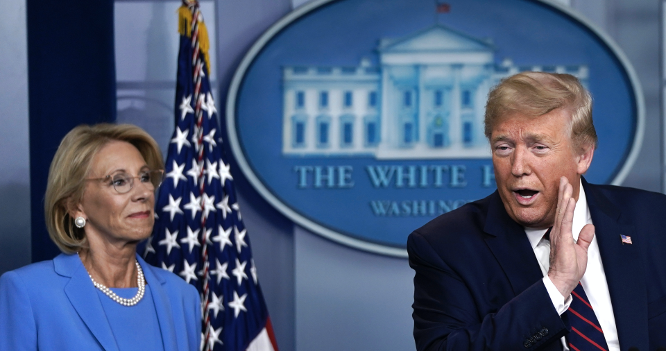 U.S. President Donald Trump speaks as Secretary of Education Betsy DeVos and Secretary of Agriculture Sonny Perdue look on during a briefing on the coronavirus pandemic in the press briefing room of the White House on March 27, 2020 in Washington, DC. (Photo: Drew Angerer/Getty Images)