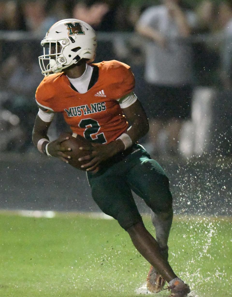 Mandarin's Jaime Ffrench Jr. (2) splashes into the end zone on an early third quarter touchdown. The Atlantic Coast Stingrays traveled to Mandarin to play the Mustangs in High School football Friday, September 15, 2023.