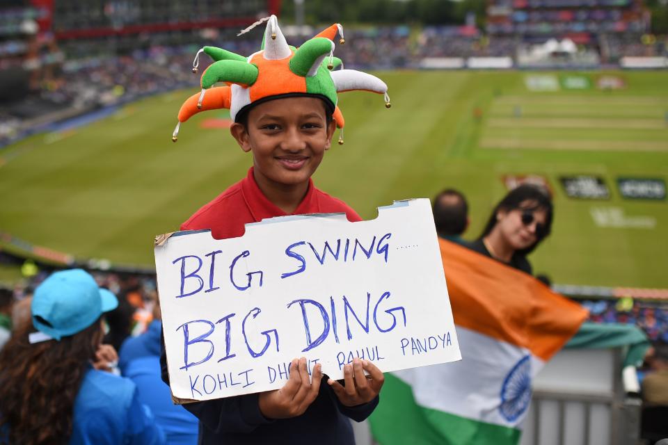 A young Indian supporter watching on as Sharma and KL Rahul start well for India (Photo by OLI SCARFF/AFP/Getty Images)