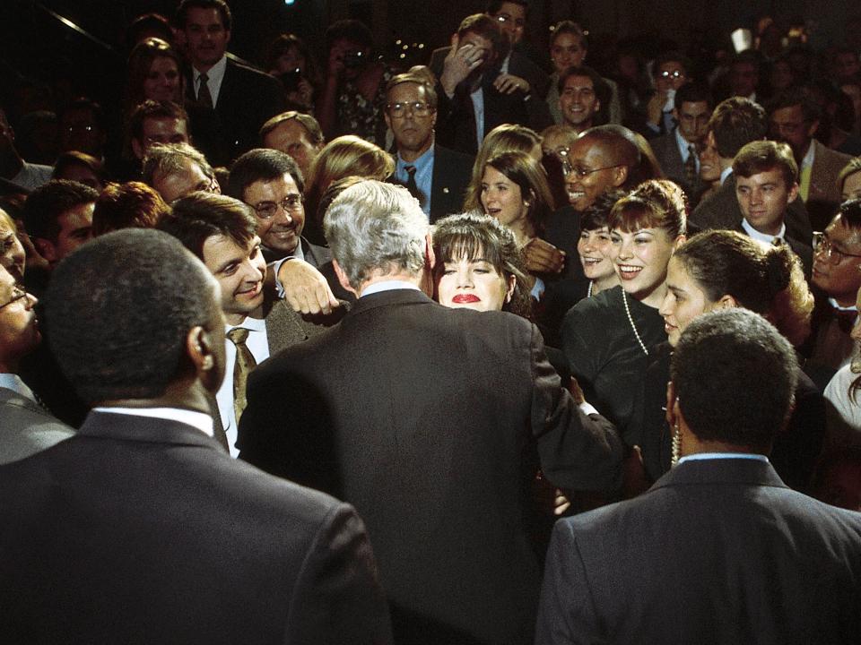 Monica Lewinsky embraces President Bill Clinton at a Democratic fundraiser in October 1996.