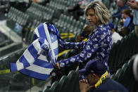 A Tampa Bay Rays fan watches during the ninth inning in Game 5 of the baseball World Series against the Los Angeles Dodgers Sunday, Oct. 25, 2020, in Arlington, Texas. (AP Photo/Tony Gutierrez)