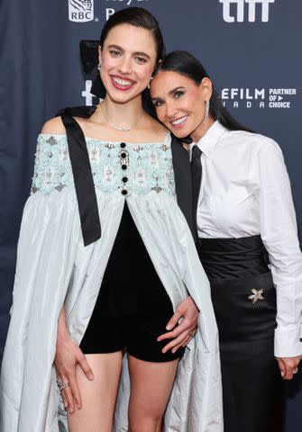 <p>Cindy Ord/Getty</p> Margaret Qualley and Demi Moore