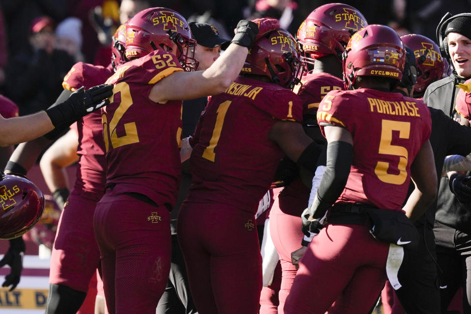 Iowa State defensive back Anthony Johnson Jr. (1) celebrates with teammates after intercepting a pass during the first half of an NCAA college football game against West Virginia, Saturday, Nov. 5, 2022, in Ames, Iowa. (AP Photo/Charlie Neibergall)