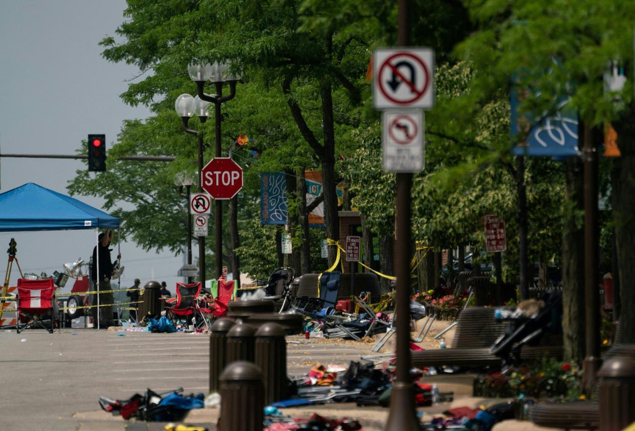 Chairs and belongings are seen left behind a day later at the scene of a mass shooting at a July 4th Parade in downtown Highland Park, Ill.