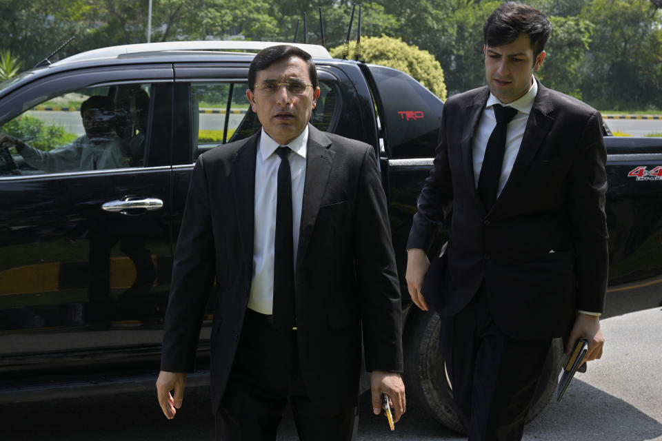 Gohar Khan, center, a lawyer of Pakistan's former Prime Minister Imran Khan's legal team, arrives at a court to file petition against Khan's conviction, in Islamabad, Pakistan, Tuesday, Aug. 8, 2023. The lawyers for Khan petitioned a top court in the capital, Islamabad, on Tuesday, seeking the suspension of his conviction and sentencing of three years in jail in a graft case and requesting his release, a spokesman for the former premier's legal team said. (AP Photo/Anjum Naveed)