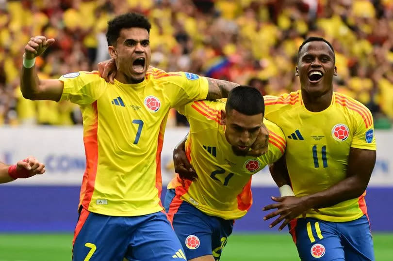 Daniel Muñoz of Colombia celebrates with teammate Luis Diaz after scoring the team's first goal during the CONMEBOL Copa America 2024 Group D match between Colombia and Paraguay at NRG Stadium