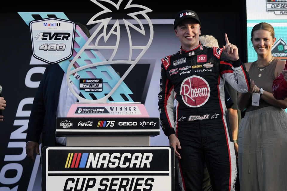 Christopher Bell celebrates after winning the NASCAR Cup Series auto race at Homestead-Miami Speedway, Sunday, Oct. 22, 2023, in Homestead, Fla. (AP Photo/Wilfredo Lee)