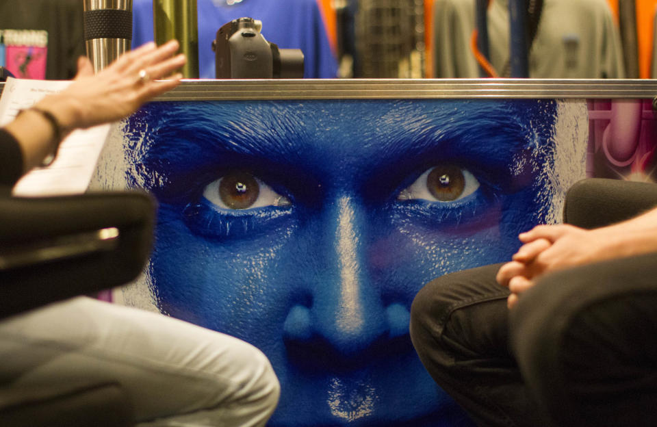 In this July 9, 2013 photograph, Rachel Schripsema, left, interviews Blue Man Group hopeful Ian McCabe during a casting call at the Briar Street Theatre in Chicago. Blue Man Group, which started with three friends in New York more than two decades ago, has grown from an off-Broadway show to also have productions in Boston, Chicago, Las Vegas and Orlando, Fla. A tour will soon take the blue men to stops in cities like Atlantic City, N.J.; Durham, N.C.; Lincoln, Neb.; Corpus Christi, Texas; Portland, Maine; and Kennewick, Wash. (AP Photo/Scott Eisen)