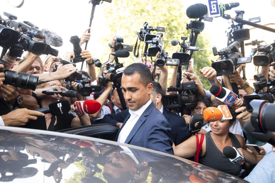 The political leader of the 5-Stars Movement, Italian Deputy Premier and Labor Minister, Luigi Di Maio, gets into his car at the end of the meeting with the staff of his party, in Rome, Monday, Aug. 26, 2019. The 5-Stars and the opposition center-left Democrats were scrambling in closed-door discussions to see if they can cobble together a coalition, despite sharp differences on who would be premier. (Angelo Carboni/ANSA via AP)