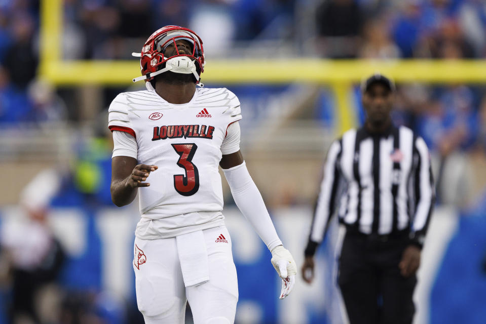 Louisville quarterback Malik Cunningham (3) reacts after a teammate gets tackled during the first half of an NCAA college football game against Kentucky in Lexington, Ky., Saturday, Nov. 26, 2022. (AP Photo/Michael Clubb)