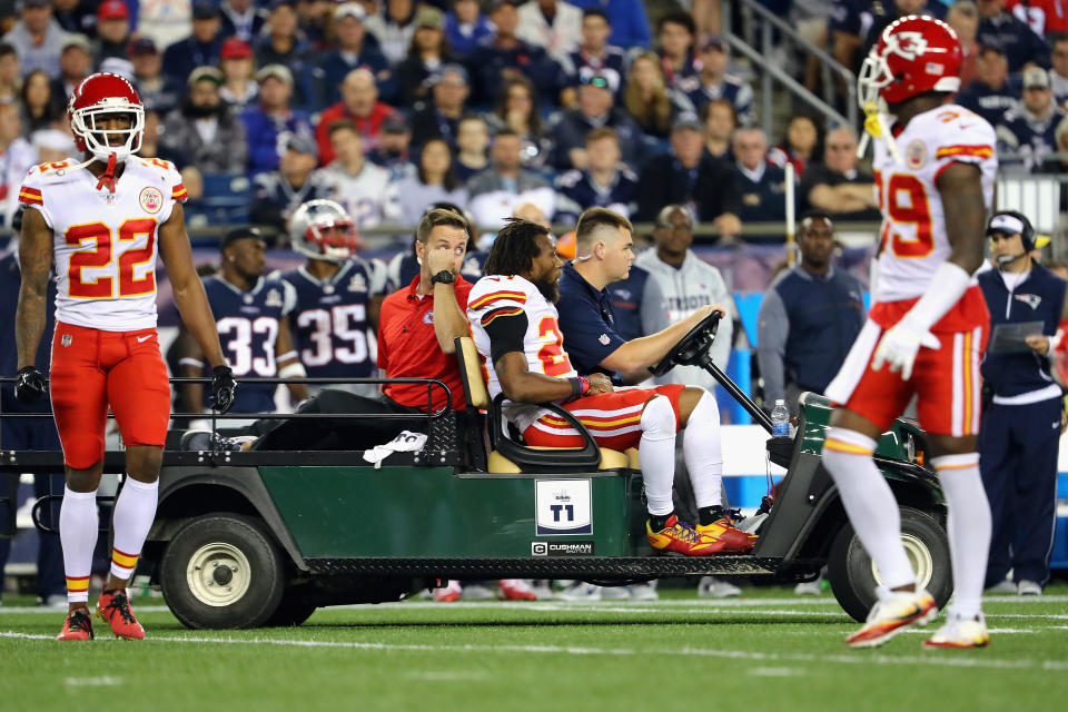Eric Berry gets carted off at Gillette Stadium on Thursday night in New England. (Getty)