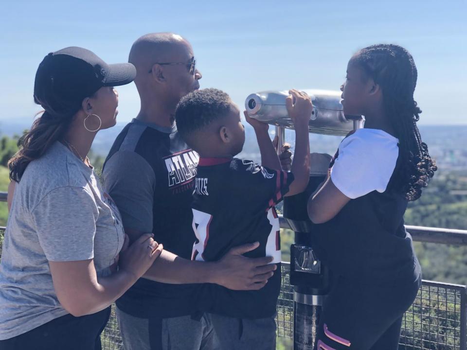 The Jenkins family of Atlanta, from the left, Nicole, Troy, Carter and Avery, enjoys a visit to Griffith Observatory.