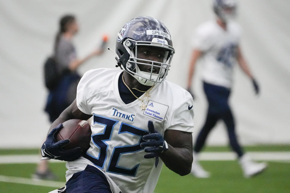 Tennessee Titans running back Tyjae Spears (32) runs through drills during the NFL football team's rookie minicamp, Saturday, May 13, 2023, in Nashville, Tenn. (AP Photo/George Walker IV)