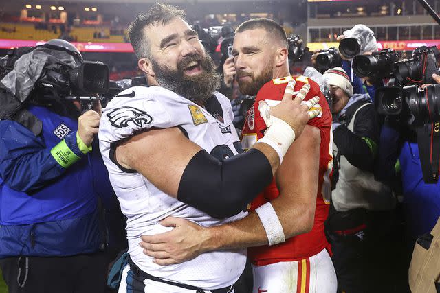 <p>Andrew Mather/Kansas City Chiefs via AP</p> Jason Kelce hugs and laughs with his younger brother Travis Kelce