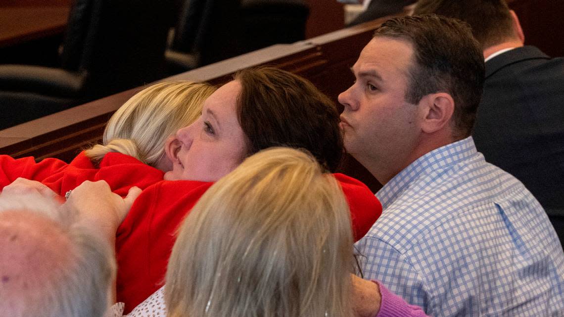April and Trey Brooks, the parents of Hailey Brooks, the 11-year-old who was struck and killed during the Raleigh Christmas Parade, are comforted by friends and family during a bond hearing for Landon Glass, the driver who lost control of his truck. Glass faces a felony involuntary manslaughter charge.
