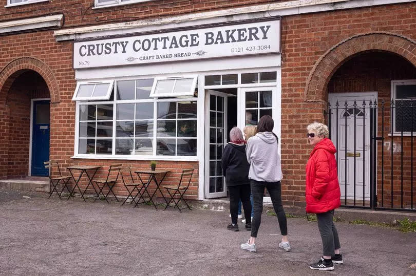 Customers queue for their turn at the Crusty Cottage Bakery on Gorsy Road, Quinton