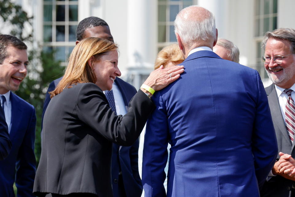 General Motors CEO Mary Barra laughs with U.S. President Joe Biden as he hosts an event for clean cars and trucks, and signs an executive order on transformaing the country’s auto fleet at the White House in Washington, U.S. August 5, 2021.  REUTERS/Jonathan Ernst