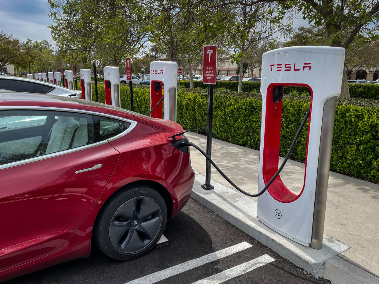 Tesla electric vehicles are lined up and charging their batteries in this outdoor public charging station just north of Santa Barbara on March 18, 2022, in Goleta, California. Photo by George Rose/Getty Images)