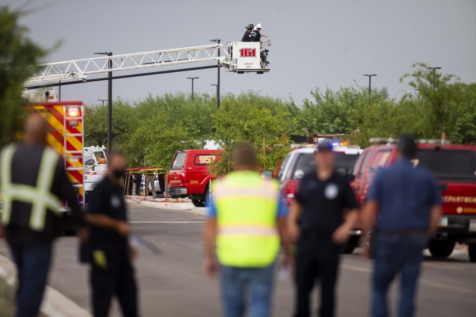 Emergency personnel work to recover the bodies of two construction workers killed at the site of a trench collapse in Phoenix on July 23, 2020.