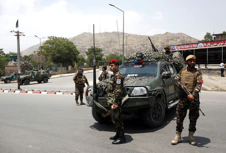 Afghan security forces keep watch at the site of a suicide attack in Kabul, Afghanistan June 4, 2018.REUTERS/Omar Sobhani