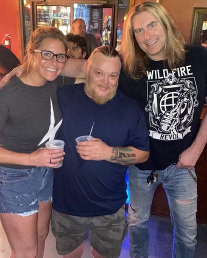 Taryn Driggers, Greg "Gonzo" Sutton and 99 Rock afternoon host Kevin McKay attending a GWAR concert at Club LA in Destin.