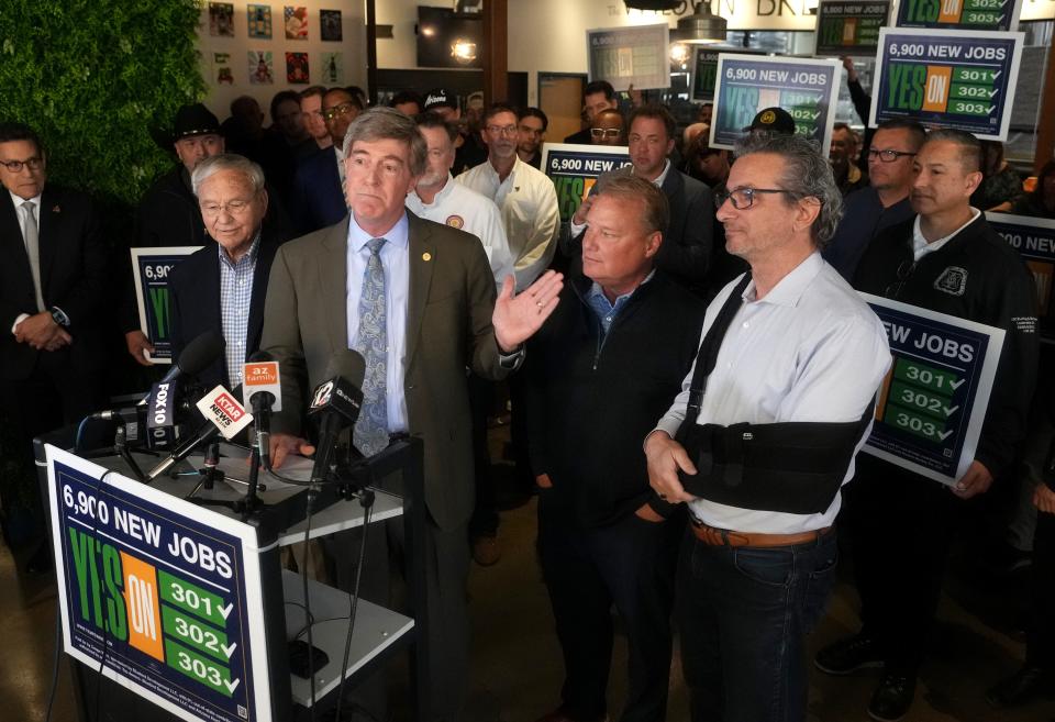 Former Mayors of Tempe Harry Mitchell, from left, Hugh Hallman, Mark Mitchell and Neil Giuliano speak as Tempe city officials and members of the Arizona Coyotes hold a news conference on March 30, 2023, in favor of the team's new stadium development plans.