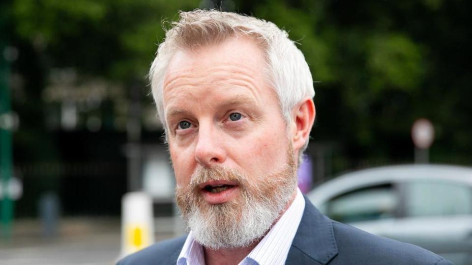 Man with white hair and beard