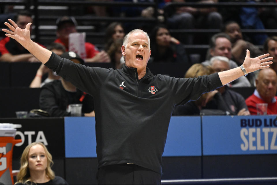 San Diego State coach Brian Dutcher yells from sideline during the first half of the team's NCAA college basketball game against UC Irvine on Saturday, Dec. 9, 2023, in San Diego. (AP Photo/Denis Poroy)