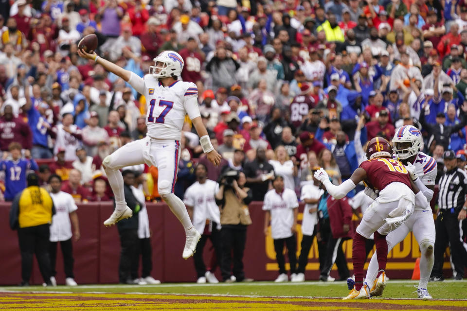 Buffalo Bills quarterback Josh Allen (17) leaping into the endzone to score a touchdown against the Washington Commanders during the second half of an NFL football game, Sunday, Sept. 24, 2023, in Landover, Md. (AP Photo/Andrew Harnik)