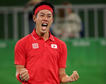 2016 Rio Olympics - Tennis - Quarterfinal - Men's Singles Quarterfinals - Olympic Tennis Centre - Rio de Janeiro, Brazil - 12/08/2016. Kei Nishikori (JPN) of Japan celebrates after winning his match against Gael Monfils (FRA) of France. REUTERS/Kevin Lamarque