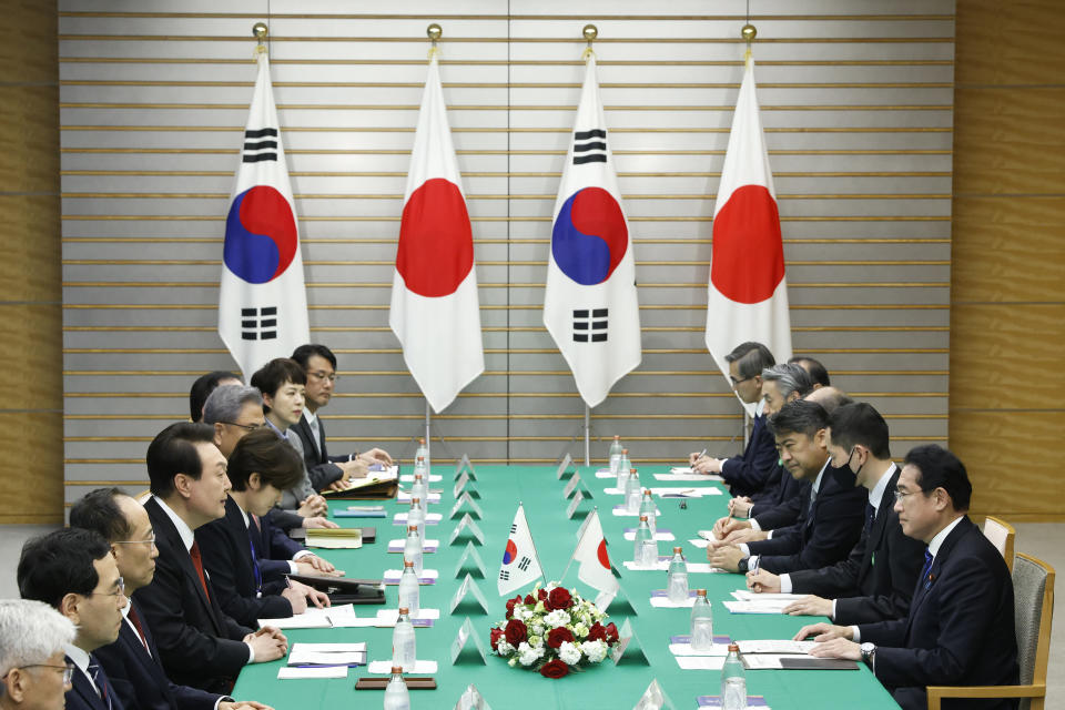 South Korean President Yoon Suk Yeol, fourth left, and Japanese Prime Minister Fumio Kishida, right, attend their bilateral meeting at the Prime Minister's Office, in Tokyo, Japan, Thursday, March 16, 2023. (Kiyoshi Ota/Pool Photo via AP)