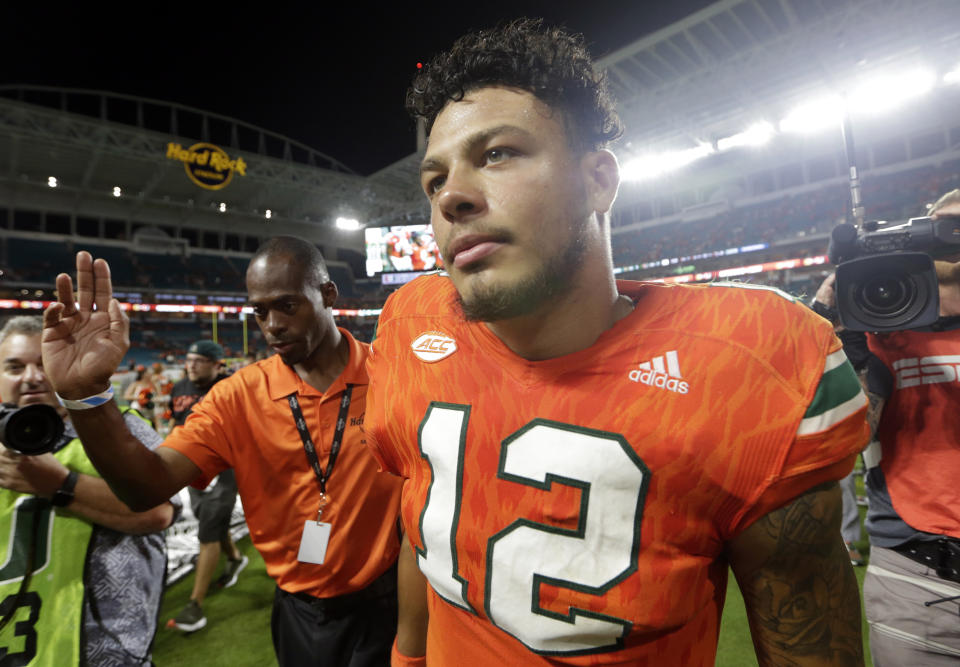 Miami quarterback Malik Rosier (12) walks off the field after an NCAA college football game against Notre Dame, Saturday, Nov. 11, 2017, in Miami Gardens, Fla. Miami won 41-8. (AP Photo/Lynne Sladky)