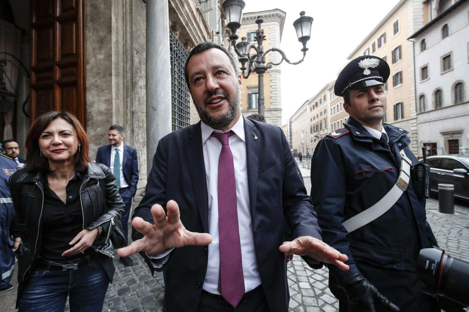 Italian Deputy Premier and Interior Minister Matteo Salvini, center, leaves the Senate in Rome, Friday, March 8, 2019. Italy's coalition government is fraying over the stalled high-speed rail line to France. While the League insists it go ahead, the 5-Star Movement is refusing to fund the next phase until the whole deal is renegotiated. Five-Star leader Luigi Di Maio warned Friday it would be ridiculous for the government to fall over the dispute, as he rebuked fellow deputy premier and League leader Matteo Salvini. (Giuseppe Lami/ANSA via AP)