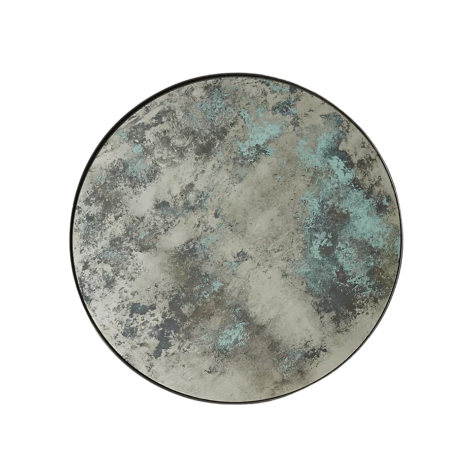 A circular color-washed mirror