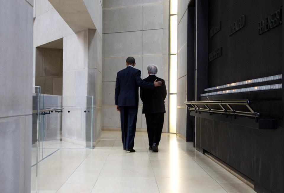 President Barack Obama and Nobel Peace Prize laureate and Holocaust survivor Elie Wiesel leave after lighting candles in the Hall of Remembrance as they toured the Holocaust Memorial Museum in Washington, Monday, April 23, 2012. (AP Photo/Carolyn Kaster)