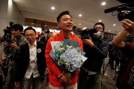 Democratic Alliance for the Betterment and Progress of Hong Kong candidate Vincent Cheng celebrates after winning the Legislative Council by-election in Hong Kong, China March 12, 2018. REUTERS/Bobby Yip