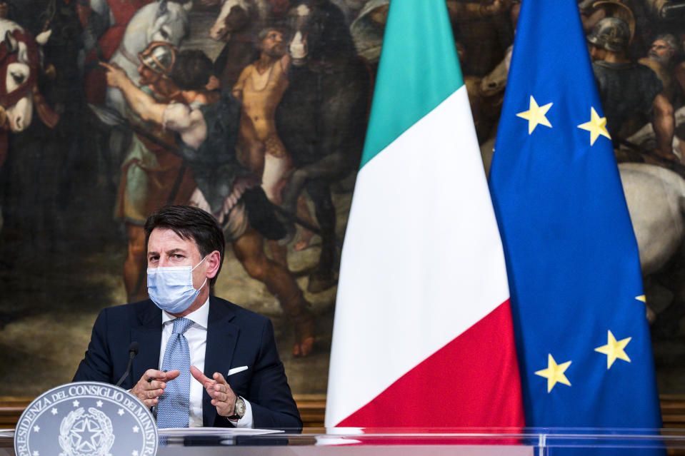 Italian Premier Giuseppe Conte speaks during a press conference at Chigi Palace government office in Rome, Wednesday, Nov. 4, 2020. Conte announced what he described as “very stringent” restrictions on the so-called “red zone” regions of high risk: Lombardy, Piedmont, Valle d’Aosta in the north, and Calabria, the region forming the “toe” in the south of the Italian peninsula. Four regions in Italy are being put under severe lockdown, forbidding people to leave their homes except for essential reasons such as food shopping and work in a bid to slow surging COVID-19 infections and prevent hospitals from being overwhelmed. (Angelo Carconi ANSA pool/LaPresse via AP)