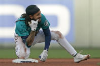 Seattle Mariners' J.P. Crawford reacts at second base after he hit a double against the Houston Astros during the third inning of a baseball game Friday, May 27, 2022, in Seattle. (AP Photo/Ted S. Warren)