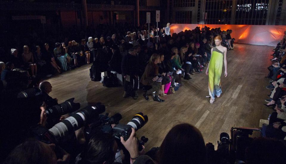 A model wears a design created by Matthew Williamson during London Fashion Week, at The Royal Opera House in west London, Sunday, Feb. 17, 2013. (Photo by Joel Ryan/Invision/AP)