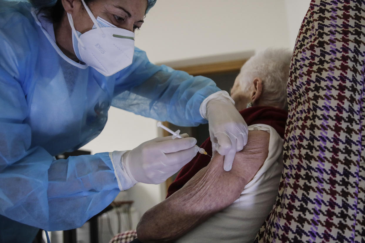 Apollonia Capelli, 101, gets her first shot of the Moderna COVID-19 Vaccine at the Martino Zanchi nursing home, in Alzano Lombardo, northern Italy, Wednesday, Feb. 24, 2021. (AP Photo/Luca Bruno)