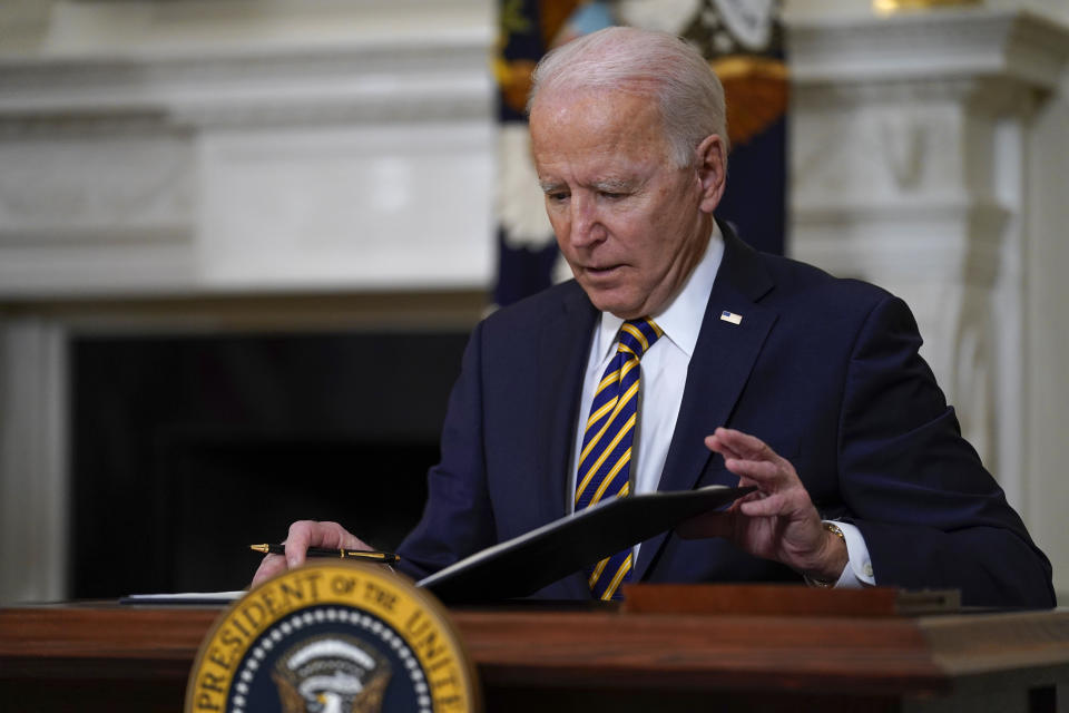 FILE - In this Feb. 24, 2021, file photo President Joe Biden closes the folder after signing an executive order relating to U.S. supply chains, in the State Dining Room of the White House in Washington. The Biden administration is giving a bit of simple advice to businesses that are unable to find workers: Offer them more money. This recommendation, included in a White House memo about the state of the economy, gets at a fundamental tension in an economy that is returning to full health after the coronavirus pandemic. (AP Photo/Evan Vucci, File)